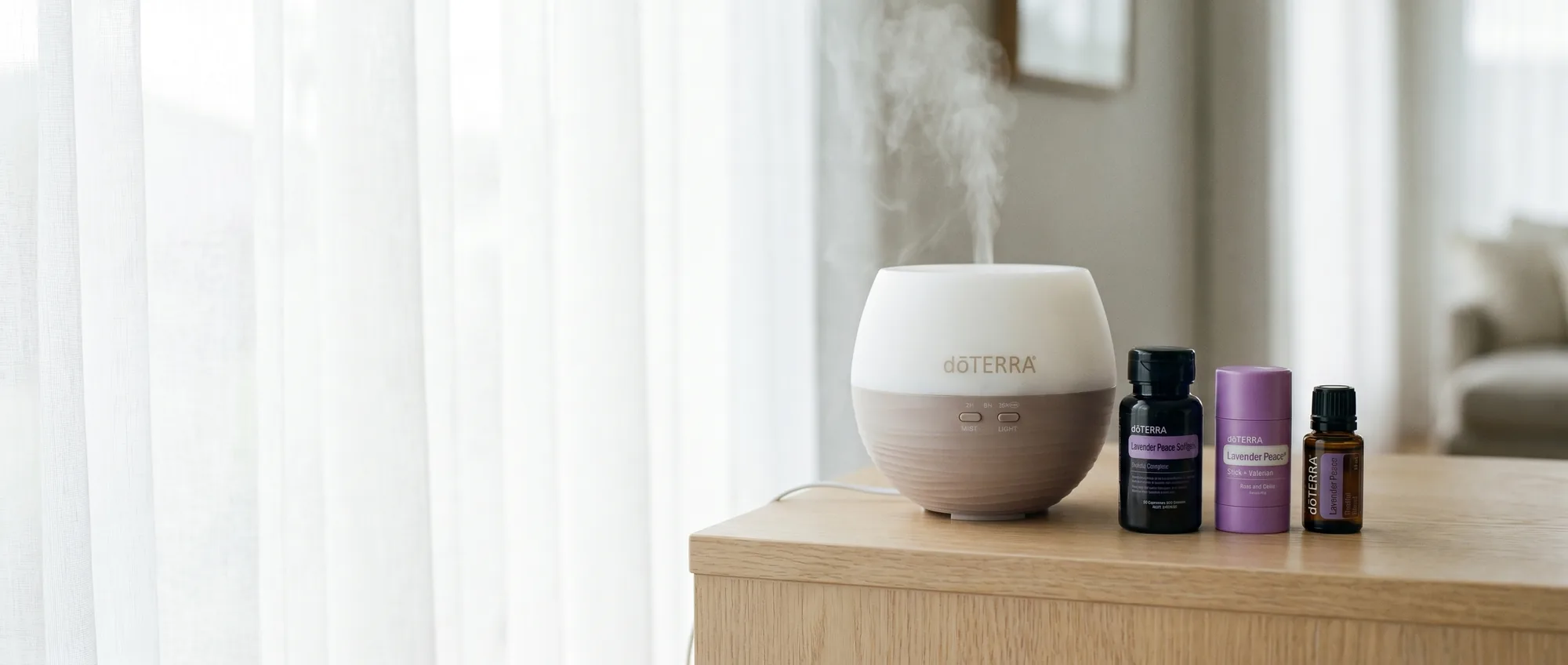 The dōTERRA Sleep Well Pack range — Petal Diffuser misting beside the Lavender Peace products — in bright daylight