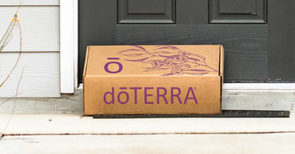 A dōTERRA delivery box placed at a doorstep, representing the best essential oils for natural wellness and ethical sourcing.