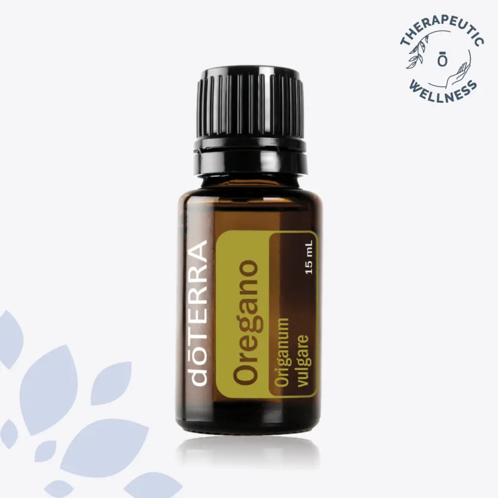 dōTERRA Oregano Oil in a 15mL amber glass bottle with a black cap, featuring a green and gold label, set against a clean background with botanical accents.