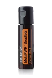 Product image of dōTERRA MetaPWR Beadlets in a sleek black tube with orange labeling, shown against a white background.